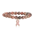 Pink agate beaded bracelet with ribbon charm and crystal accents on white background - Glossy Pink Zebra + Gold Spacer