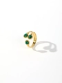 Detail of gold titanium ring with three round green malachite stones and open band - Style 6 (Three Round Green Stones Open)