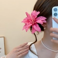 Elegant large pink lily fabric flower hair clip shown on model for a romantic resort look - 38# Duckbill Clip - Rose Red - Pink Lily Style