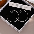 Polished silver large hoop clip-on earrings displayed in a black velvet jewelry box - 5cm Silver/Ear Clip