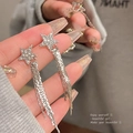 Close-up of star shaped tassel earrings with sparkling rhinestones and long metal chains - A1519 Silver