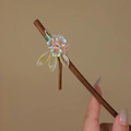 Detail of handcrafted bamboo hair pin with translucent glass flowers and green silk threads - Iridescent Fantasy (S404)