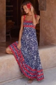 Close-up of elegant floral maxi dress featuring striking red wavy trim and blue leopard print - S / Dark Blue Printed