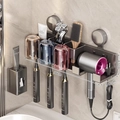 Wall-mounted gunmetal bathroom organizer with hairdryer holder and toothbrush slots - 3-Person · Colored Cup + Dispenser