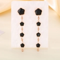 Detail view of rose gold clover drop earrings with five black floral inlays on display - Rose Gold Style (KE116363-KFC)