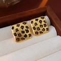 Macro shot of vintage gold earrings with leopard print enamel and amber rhinestones - Gold Square Leopard Stud Earrings