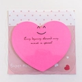 Pink heart-shaped sticky note with smiling face pattern and motivational English text - Heart