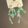 Detail of floral tassel earrings featuring green natural stone beads and white shell studs - 18# Silver Needle - Light Green
