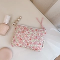 Detailed close-up of a pink floral quilted cotton storage pouch for makeup and small items - Pink Ditsy Floral