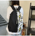 Detail of minimalist black and white backpack with lightning print and side buckle strap - Single Bag / Black and White
