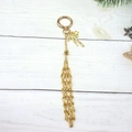 Golden mesh bag keychain with star and bow charms on white wooden festive background - Gold Round Keychain [Small Star Style]