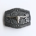 Detailed close-up of a retro zinc alloy belt buckle with bull skull and scrollwork design - BK025 Retro Silver Bull Head With Horseshoe