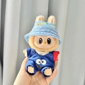 Labubu plush doll wearing blue denim overalls with Cookie Monster and a hello bucket hat - Blue Sesame Bird Three-piece Jumpsuit / First And Second Generation Keychains Are Compatible With La Cloth Dolls. Dolls Not Included.