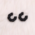 Minimalist black C-shaped twist earrings with matte texture and elegant metal pins - Black Twisted