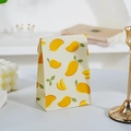 Mini gift bag with mango pattern print on cream background for party favors - Mango