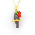 Golden necklace with grey bird pendant and red cherry enamel details on white background - Cherry Bird Style (07)