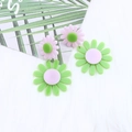 Pink and green layered daisy earrings in acrylic on white faux fur background - Daisy