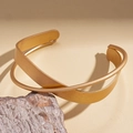 Close-up of minimalist gold-finish geometric multilayer open bangle with matte texture - Matte Cross Style / Gold