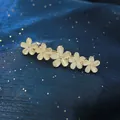 Golden spring hair clip featuring five cream flower charms on navy sequin fabric - 6cm Korean Style Opal Spring Clip