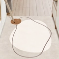 Abstract geometric PVC entry mat with beige and brown circular patterns on wood floor - 60×90CM / Ethereal Realm (Vertical)