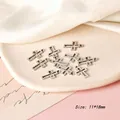 Macro shot of 11mm silver cross pendants with vintage texture for DIY jewelry making - Cross Style 11 / Antique Silver