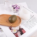 Silicone mold for realistic green kiwi fruit shape with size markings on wood tray - J34 Kiwi Fruit
