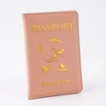 Close-up of pink PU leather passport holder with golden stamped text and sport icons - Pink
