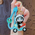 Niedlicher Panda-Biker-Schlüsselanhänger in Blau mit gewebtem Band und Goldring - Blau