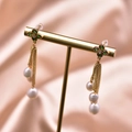 Golden baroque pearl tassel earrings with green flower zircon stud on elegant display - Tassel Pearl Green Stone Earrings