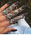 11pcs set of bohemian silver rings with turquoise stones shown on hand outdoors - 11-Piece Moon Tribal Ethnic