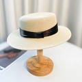 Flat top beige straw sun hat with black ribbon decoration on wooden hat stand - Beige Black Ribbon