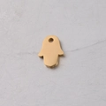 Detail of a polished golden Hamsa Hand pendant made of stainless steel with mirror finish - Gold Color Small Palm / Gold