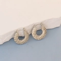 Detail view of oval C-shape earrings with vintage rock texture finish on stone - Silver Rock Texture C-Shape
