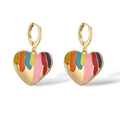 Detail of gold-plated heart earrings with colorful enamel drips on white background - Colorful Hearts Style