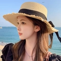 Women's straw sun hat in beige featuring a black ribbon bow and raw fringe edges - Flat Top Hemp Ribbon Beige Black
