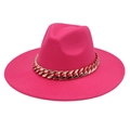 Detail view of the rose pink fedora hat featuring a chunky gold acrylic chain decoration - Adult (57-60cm) / Rose Red