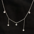 Elegant silver clavicle necklace featuring five sparkling white zircon charms on a thin chain - Rhinestone Tassel Necklace Silver