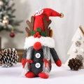 Close-up of Christmas gnome with reindeer antlers, snowflake embroidery and bell detail - Female (Braids)