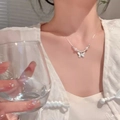 Titanium steel bow necklace with pearls and zircon pendant on a woman neck - Ladylike Pearl Butterfly (X1526) / Silver/Single Butterfly