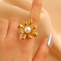 Elegant gold flower ring with a central white pearl on a champagne silk background - Gold (9506)