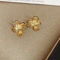 Macro shot of gold floral earrings with teardrop zircon on elegant book background - Gold Plated Copper / S925 Silver Pin / Zirconia / Hollow Flower Style (5989480272561) / Gold