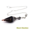 Macro shot of obsidian dowsing pendulum with copper spiral wire and silver chain - Antique Silver Obsidian