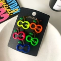 Five pieces of neon colored cherry hair clips in pink blue and orange on black card - Yellow-Green Cherries