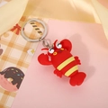 Detail showing cartoon lobster keychain with soft silicone texture and metal ring - Red Lobster (Keyring)