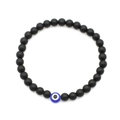Black 6mm lava stone bracelet with blue evil eye bead on white background - Matte Black Beads