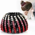 Detail view of gradient pink rhinestone nest hair claw and model styling high ponytail - Rhinestone Red