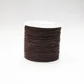 Macro shot of 0.8mm dark brown braided cord for jewelry making on a white plastic spool - Color 738 Dark Coffee