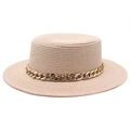 Close-up of the woven texture and gold chain detail on a beige flat top straw boater hat - Light Pink