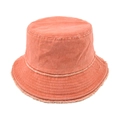 Detail of frayed edges and stitching on a vintage washed cotton bucket hat in brick red - Orange
