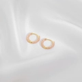 Elegant gold bamboo-joint hoop earrings with pink enamel inlay on white silk fabric - Light Purple